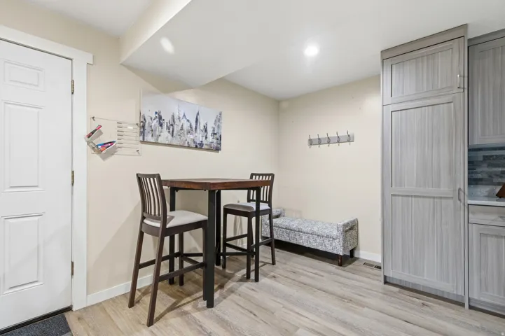 Dining area featuring light wood-style floors and recessed lighting