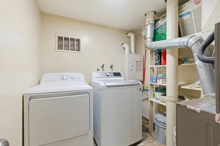 Laundry room featuring separate washer and dryer
