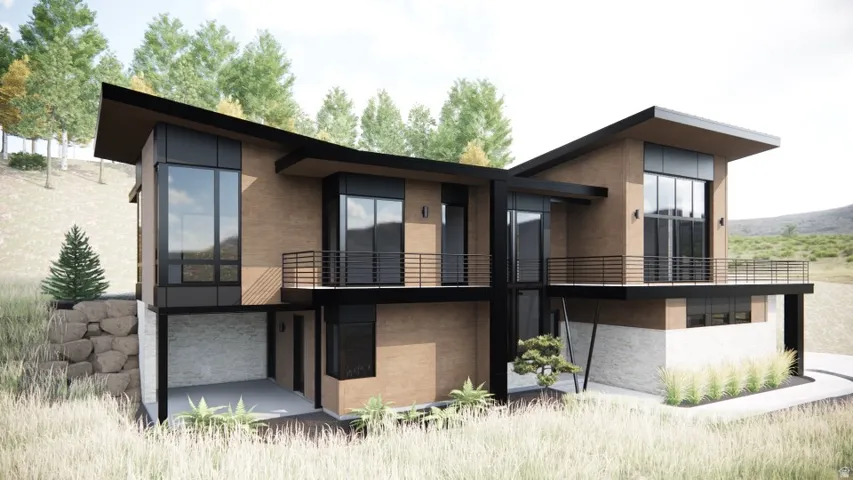Back of house featuring a balcony and stucco siding