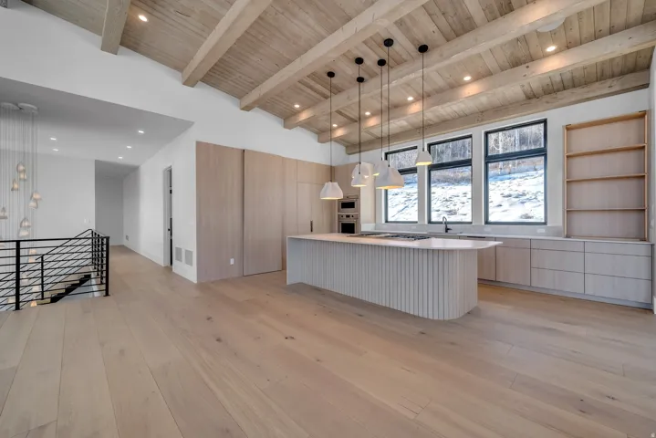 Kitchen featuring pendant lighting, modern cabinets, light brown cabinets, light wood-style flooring, and recessed lighting