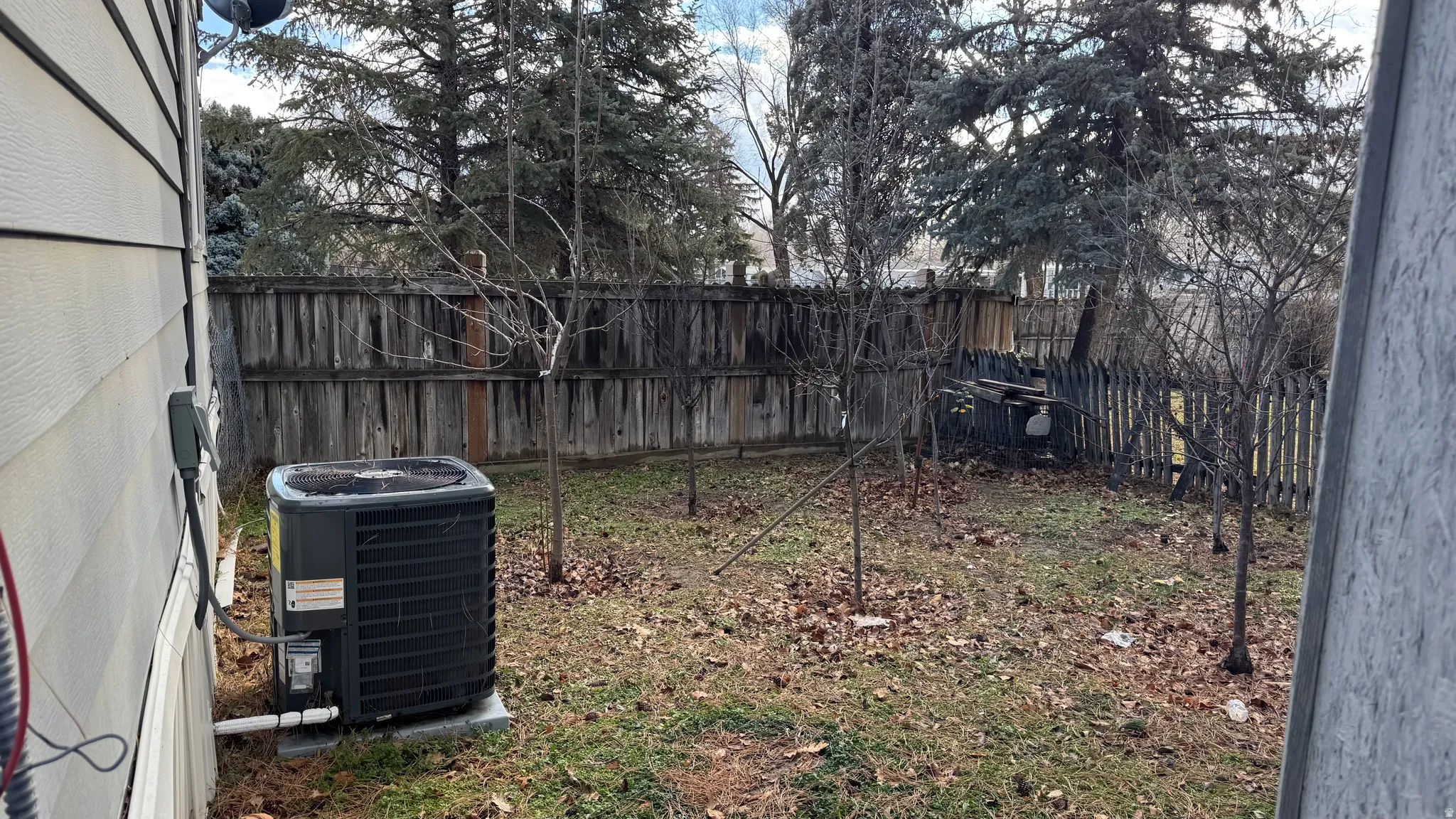 View of fenced backyard