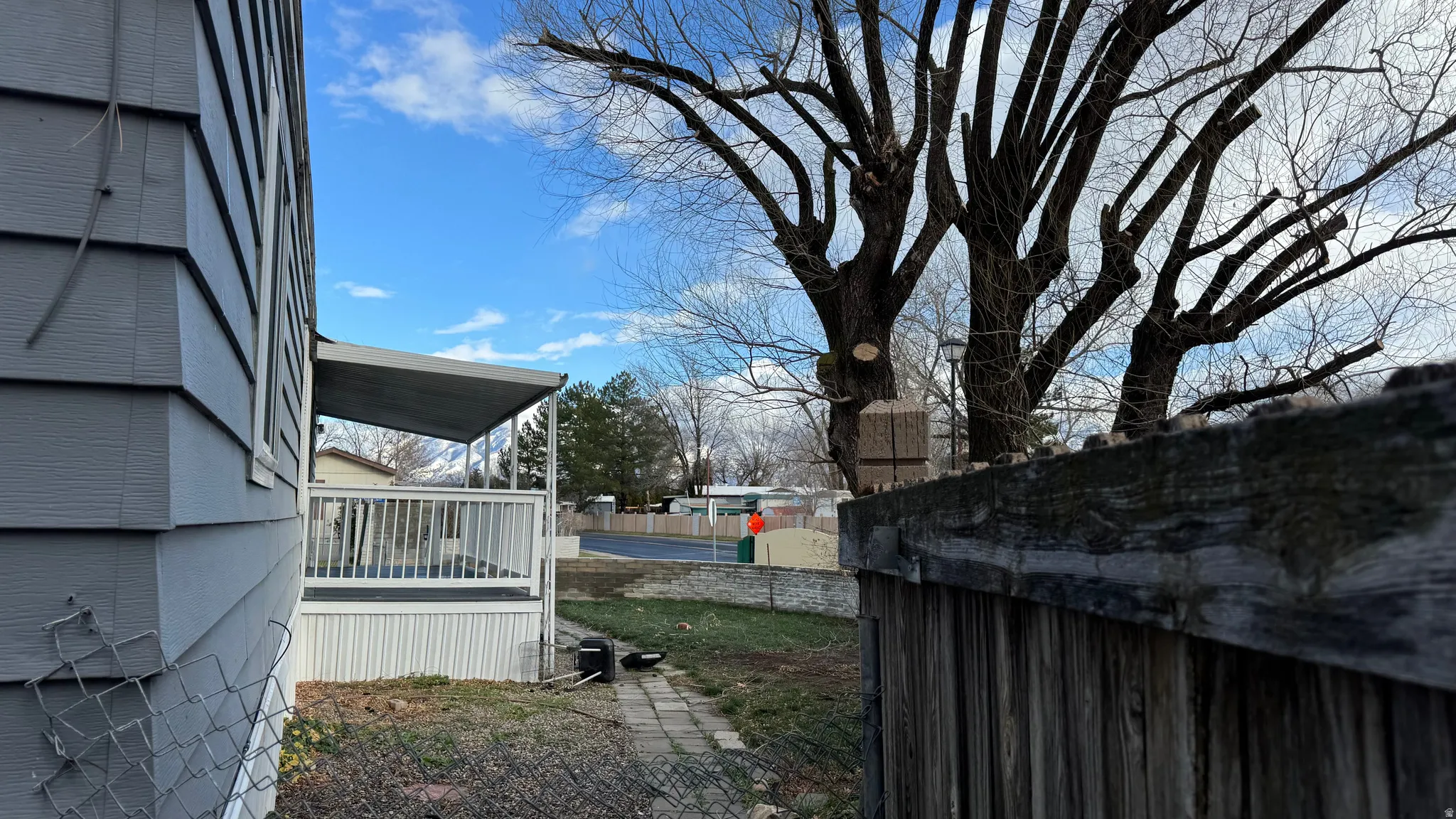 View of yard with a wooden deck