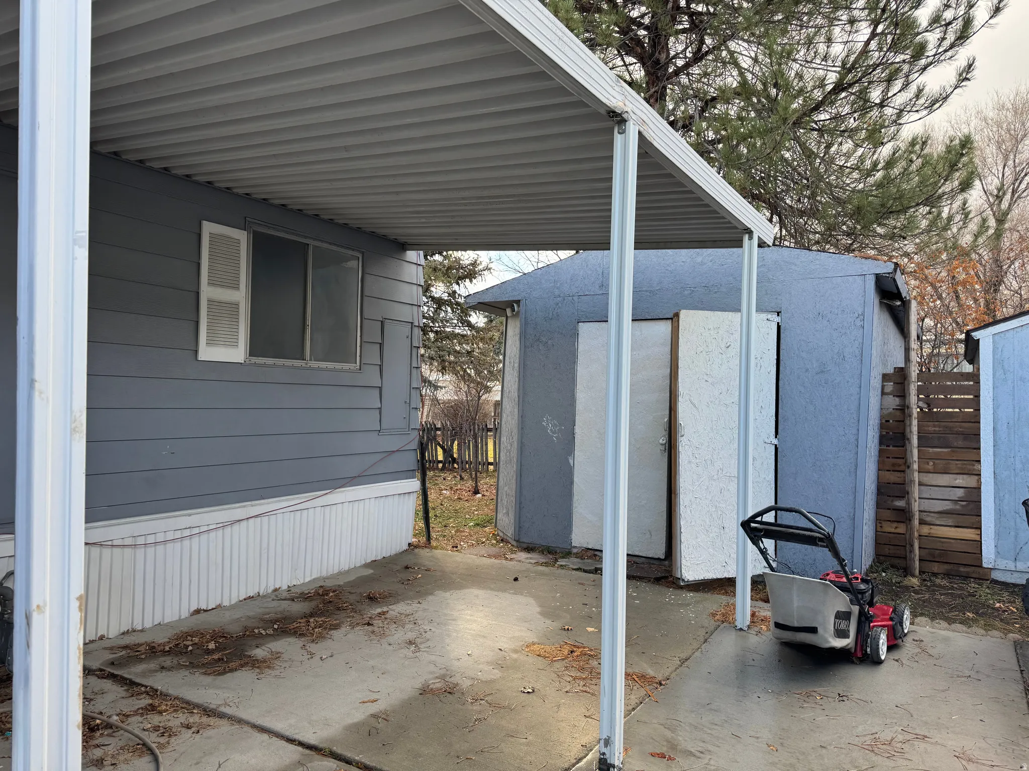 View of patio featuring a shed