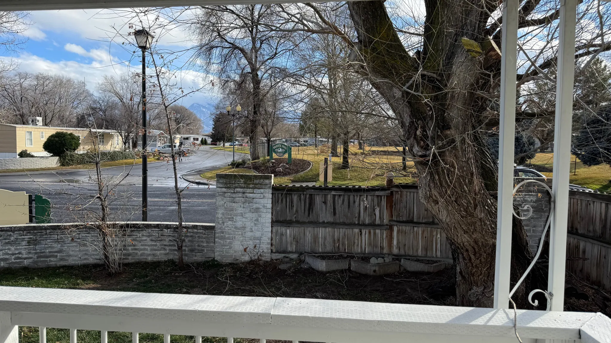 Fenced yard featuring a residential view