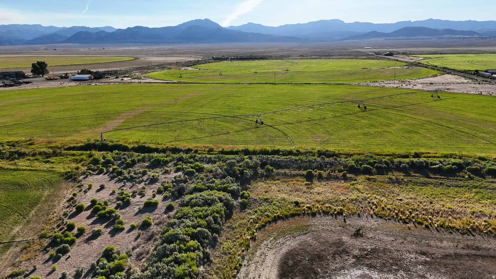 Overview of rural landscape with a mountainous background