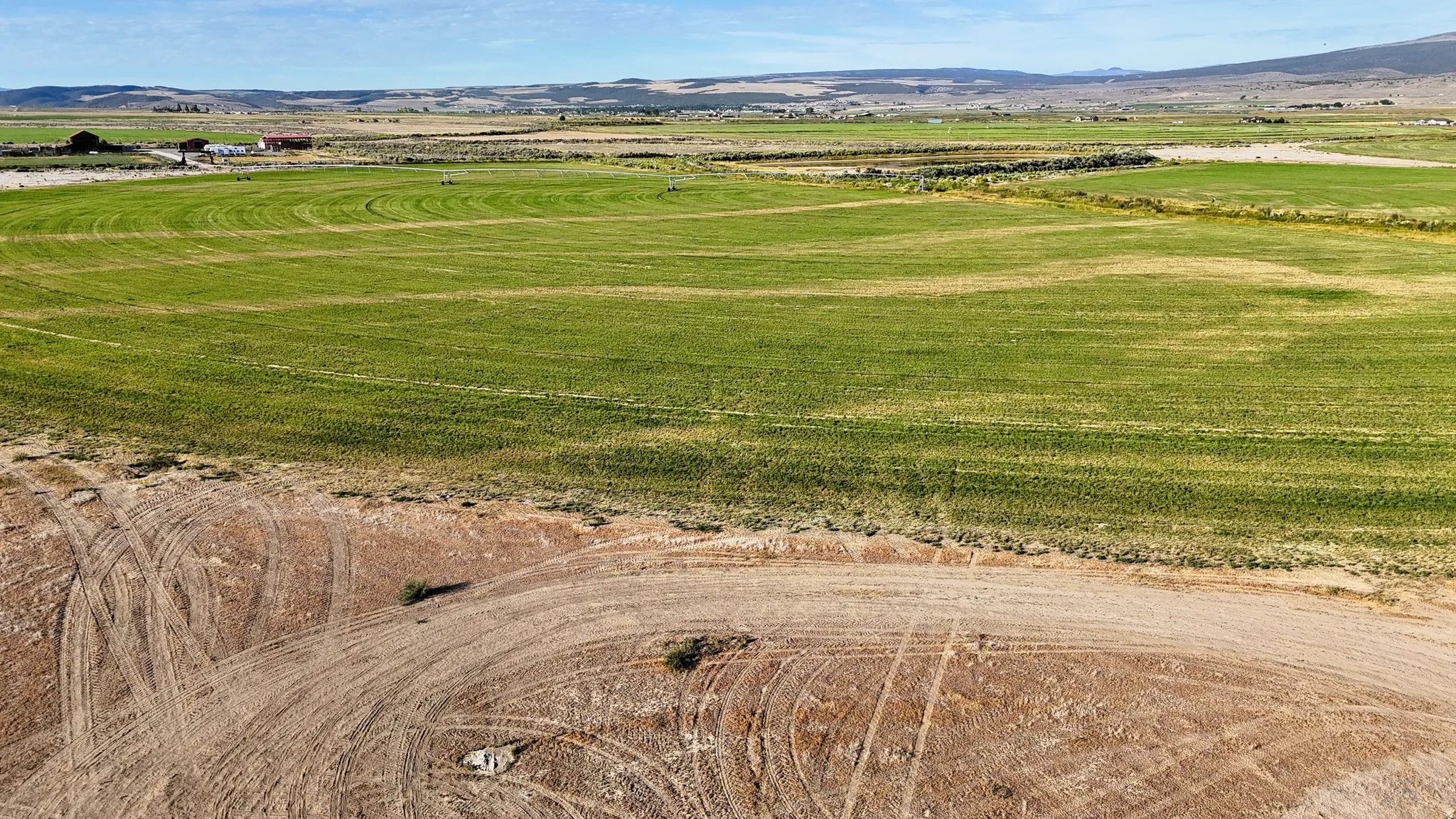 Aerial view of sparsely populated area featuring a mountainous background