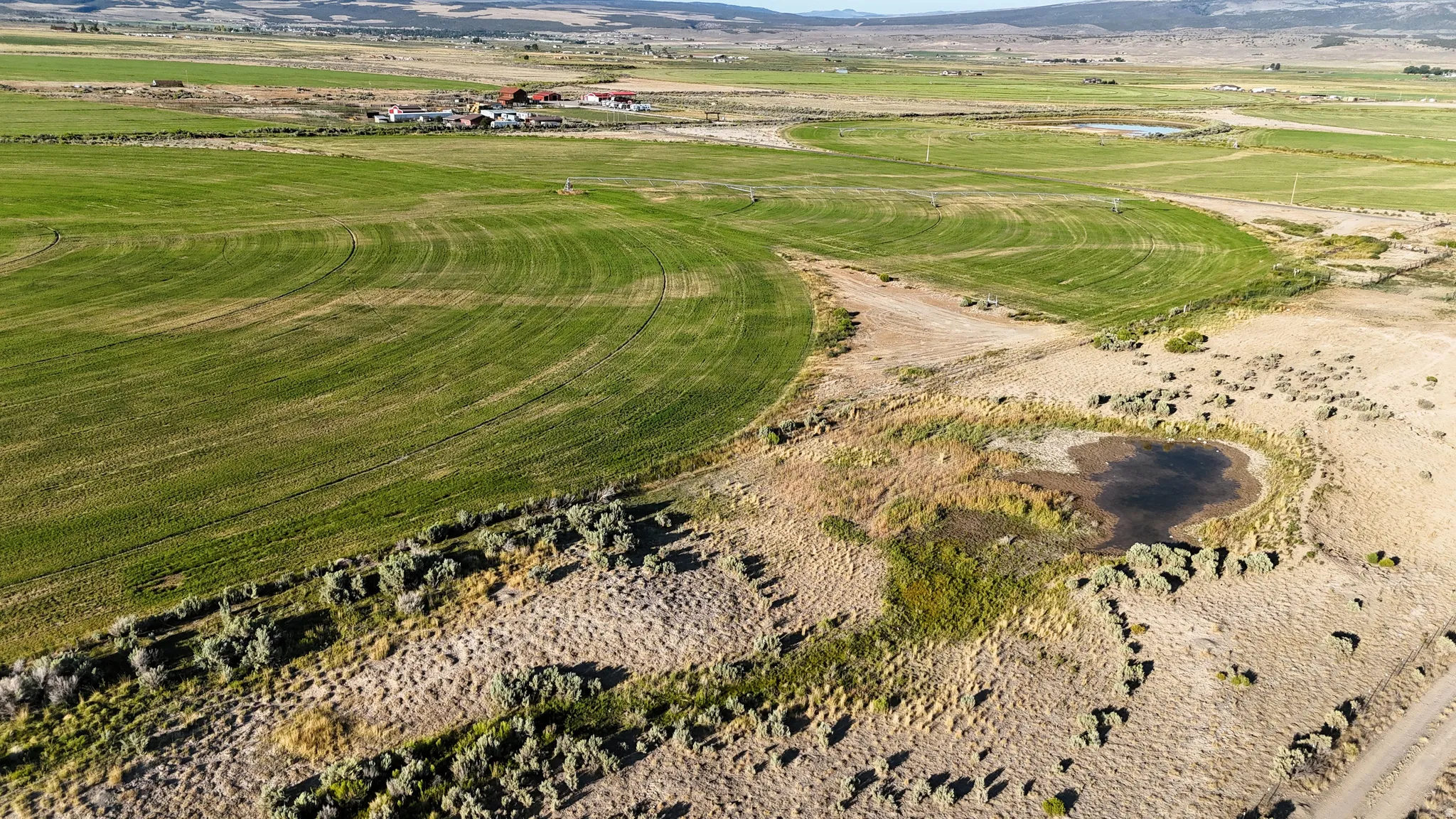 Aerial view of property's location with a mountainous background