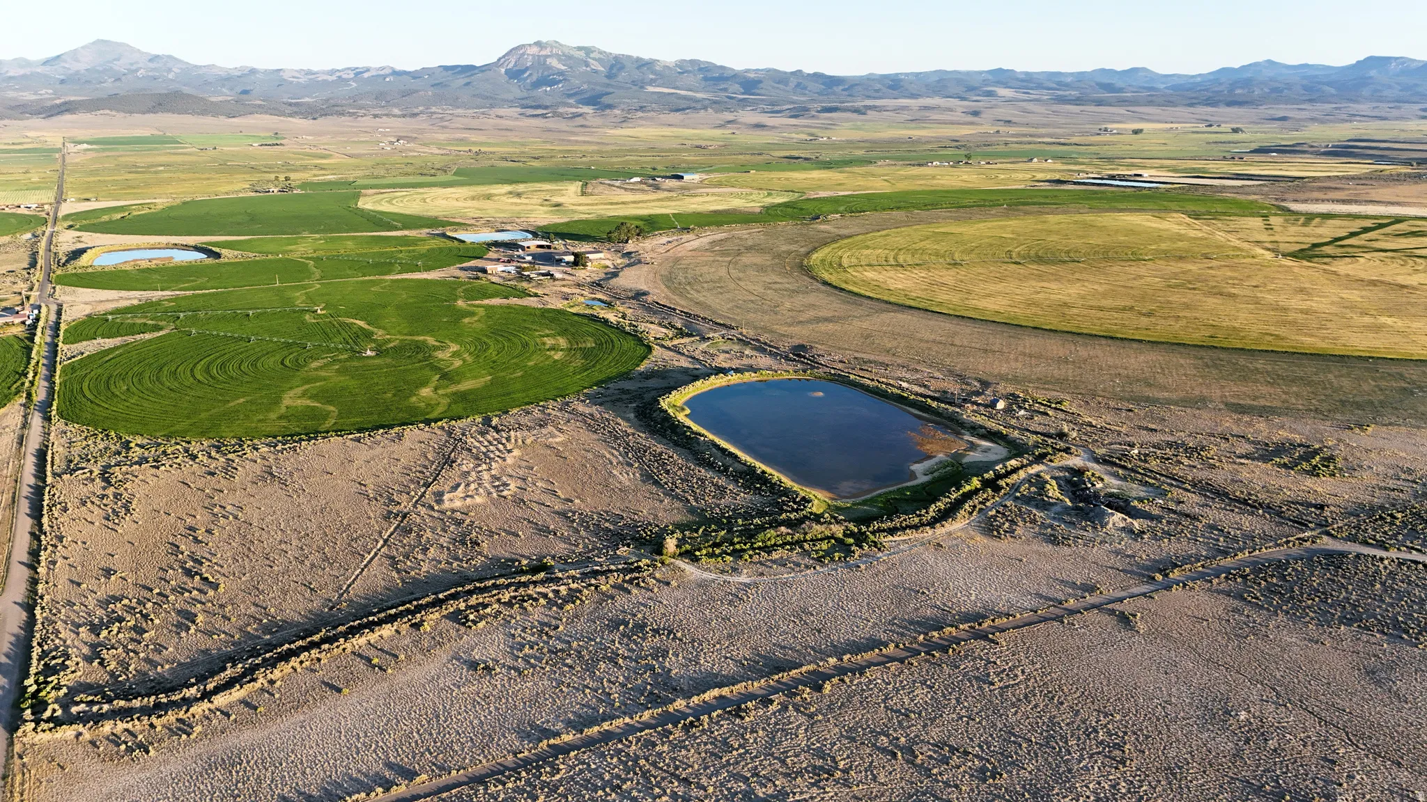 Aerial view of property's location with mountains and rural landscape