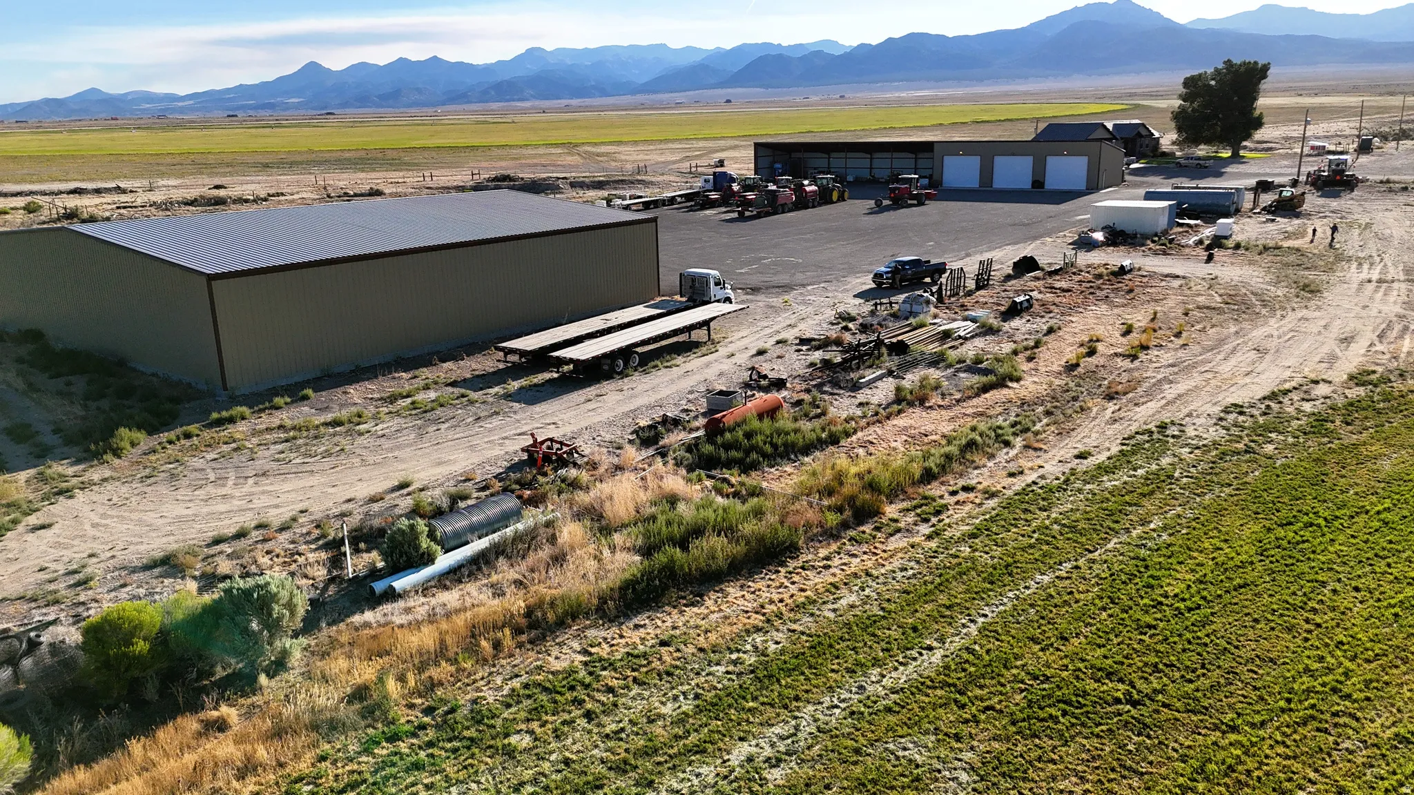 Aerial view of sparsely populated area with a mountainous background