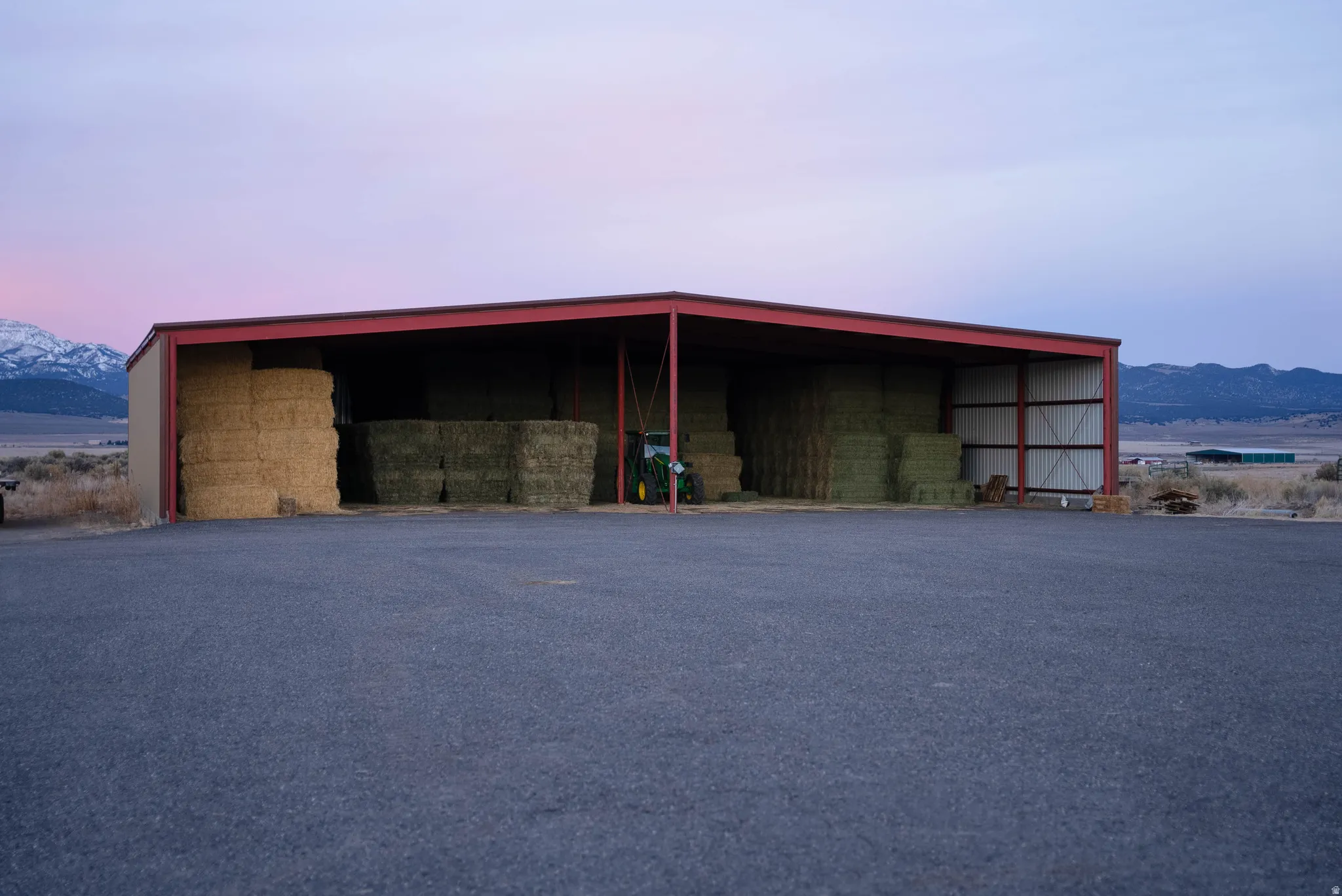 View of pole building with a mountain view