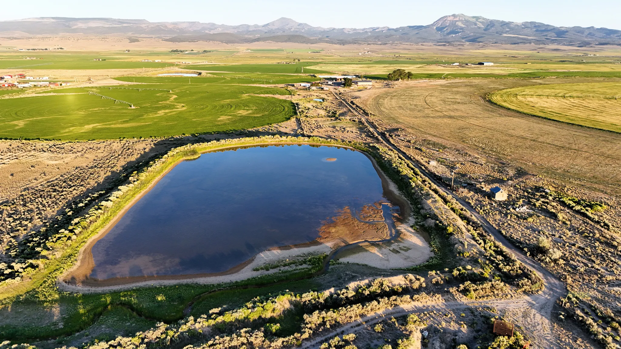 Aerial overview of property's location featuring a water and mountain view