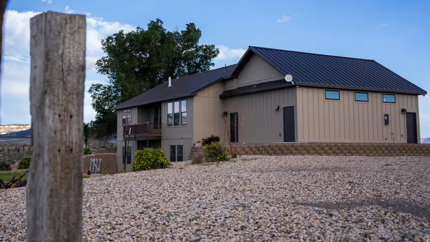 Contemporary style home featuring a metal roof and board-and-batten siding