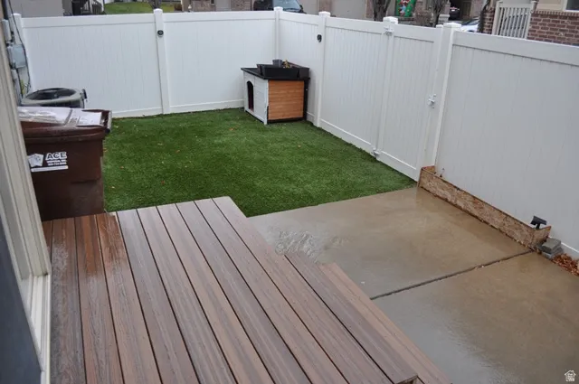 Fenced backyard with a patio area