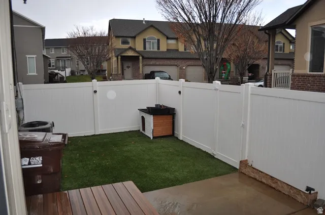 Fenced backyard with a gate