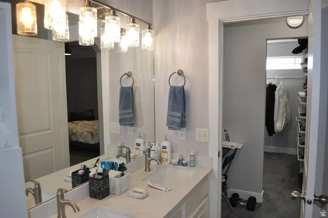 Ensuite bathroom with a spacious closet and double vanity