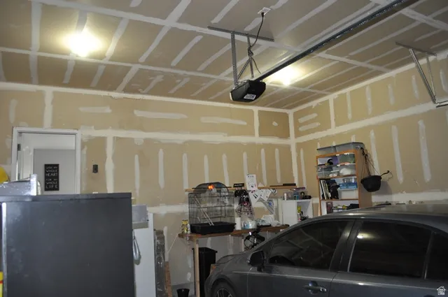 Garage featuring a garage door opener