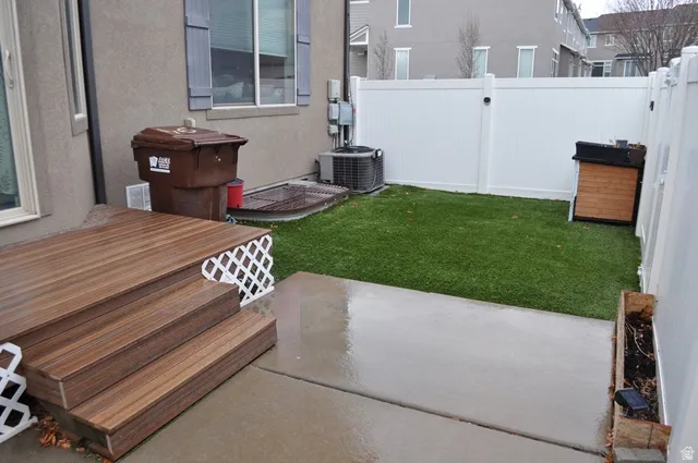 Fenced backyard with a patio area
