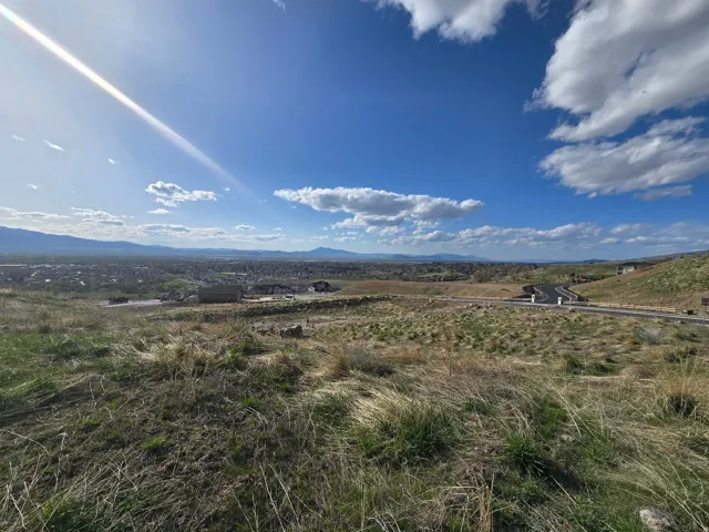 View of mountain background featuring rural landscape
