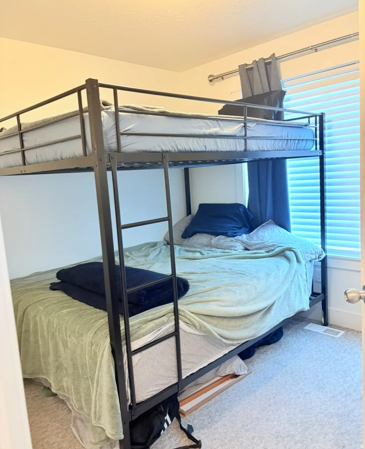 Bedroom with light carpet