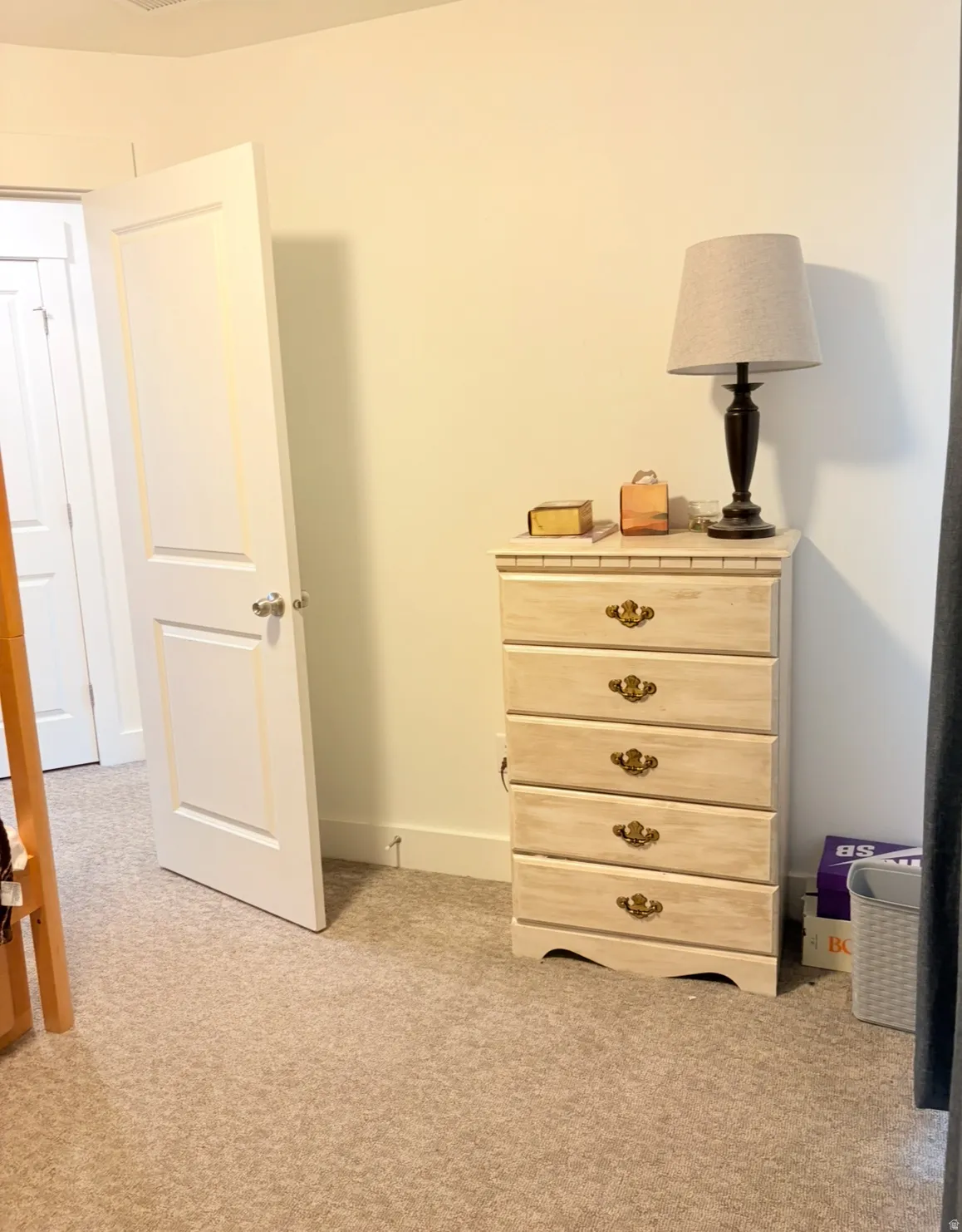 Bedroom with light colored carpet
