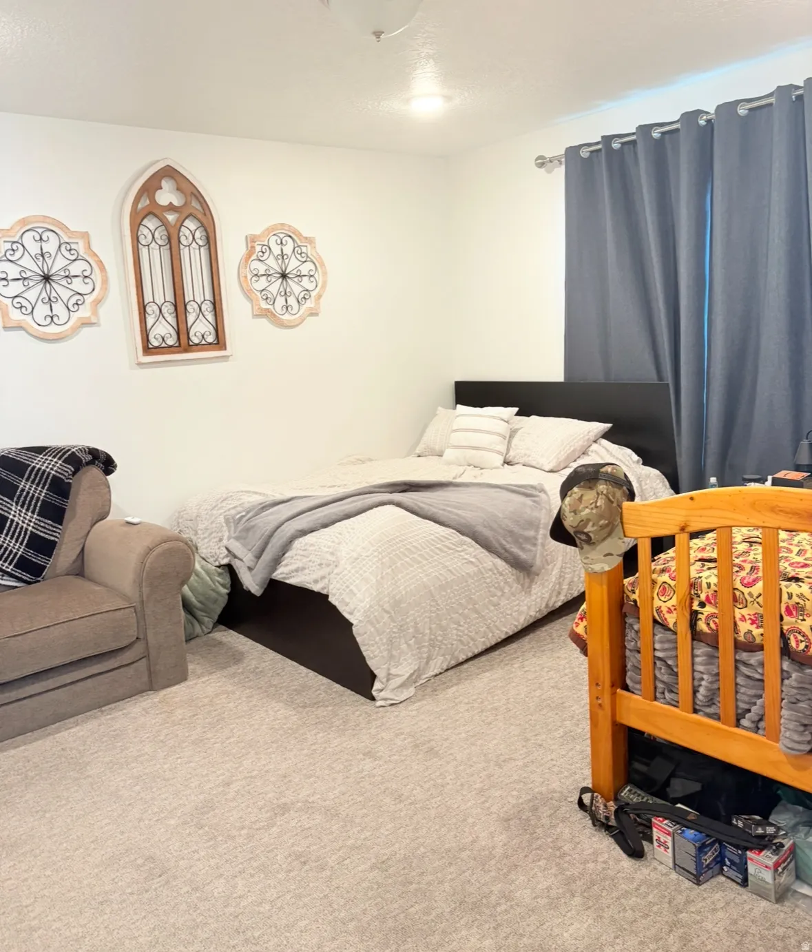 Carpeted bedroom featuring a textured ceiling
