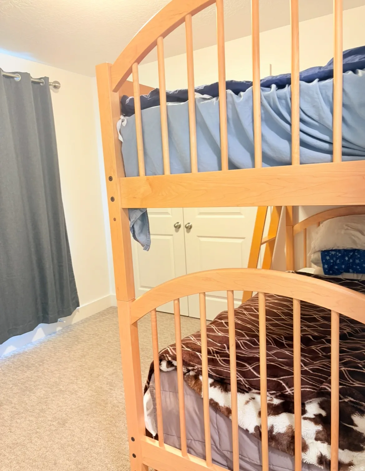 Bedroom featuring light colored carpet
