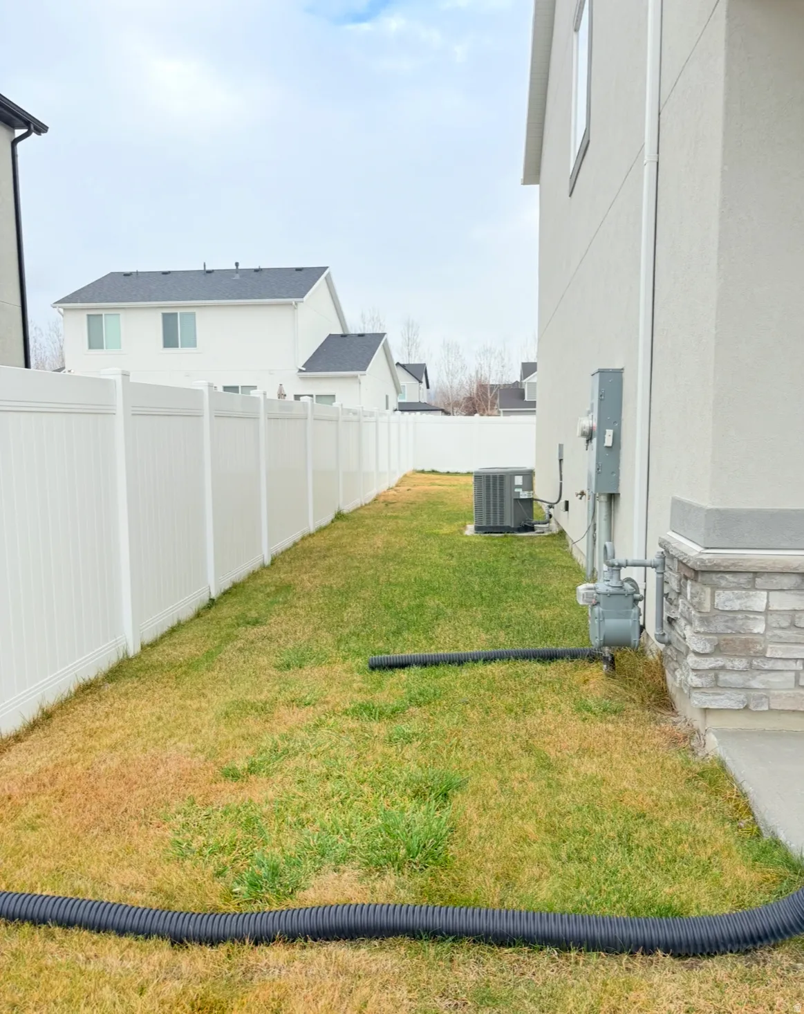 View of fenced backyard
