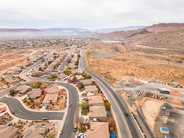 View of property location with mountains and nearby suburban area