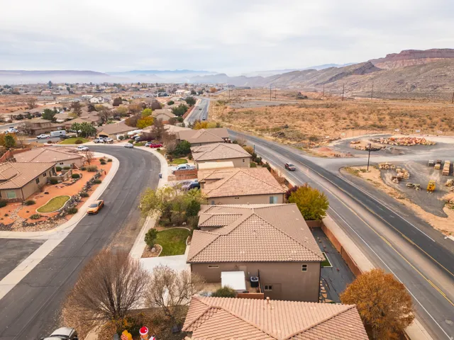 Aerial perspective of suburban area with a mountainous background