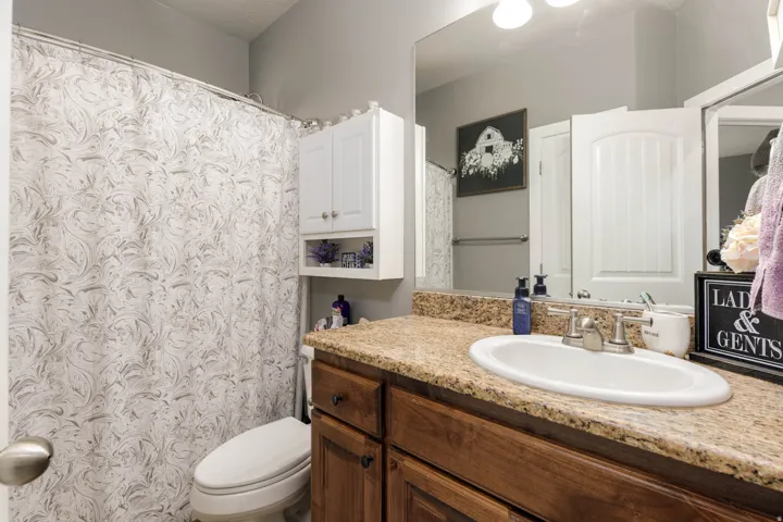 Bathroom featuring vanity and a shower with curtain