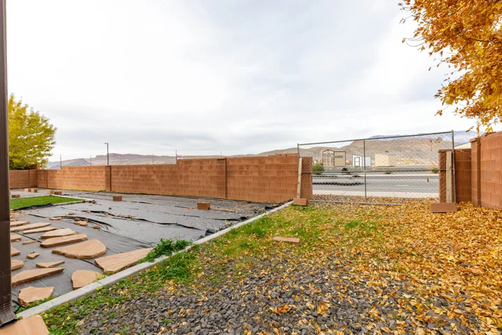 Fenced backyard with a patio area
