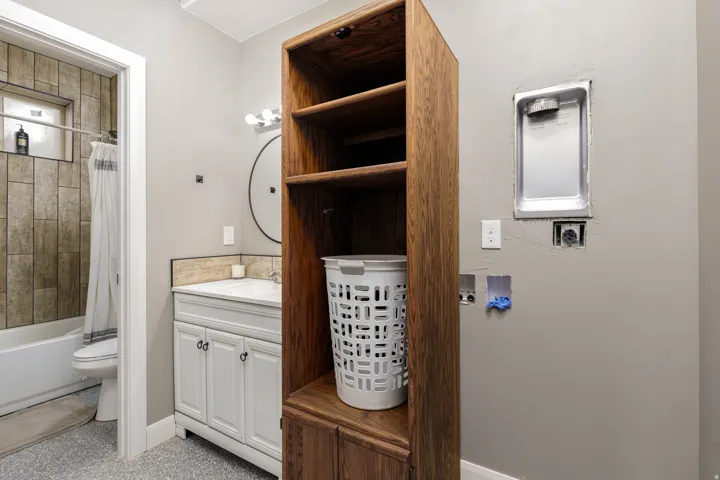 Bathroom featuring vanity and shower / bath combination with curtain