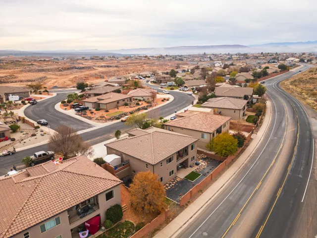 Aerial perspective of suburban area featuring a mountain backdrop