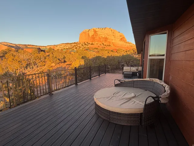 Wooden deck with a mountain view and an outdoor hangout area