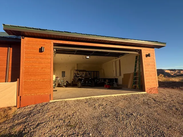 View of outdoor structure featuring a garage