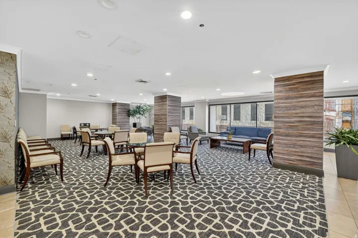 Dining area featuring light tile patterned floors, ornamental molding, and recessed lighting