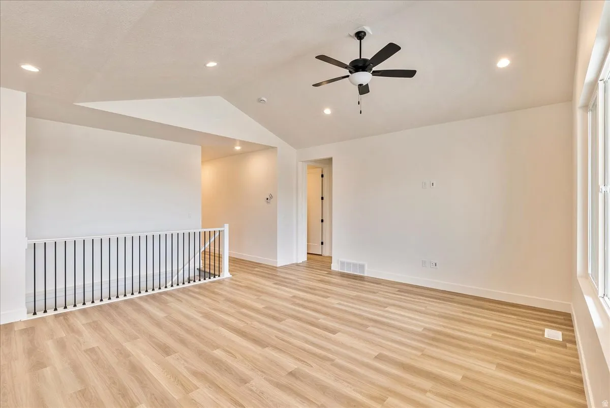 Spare room featuring a ceiling fan, light wood finished floors, and recessed lighting