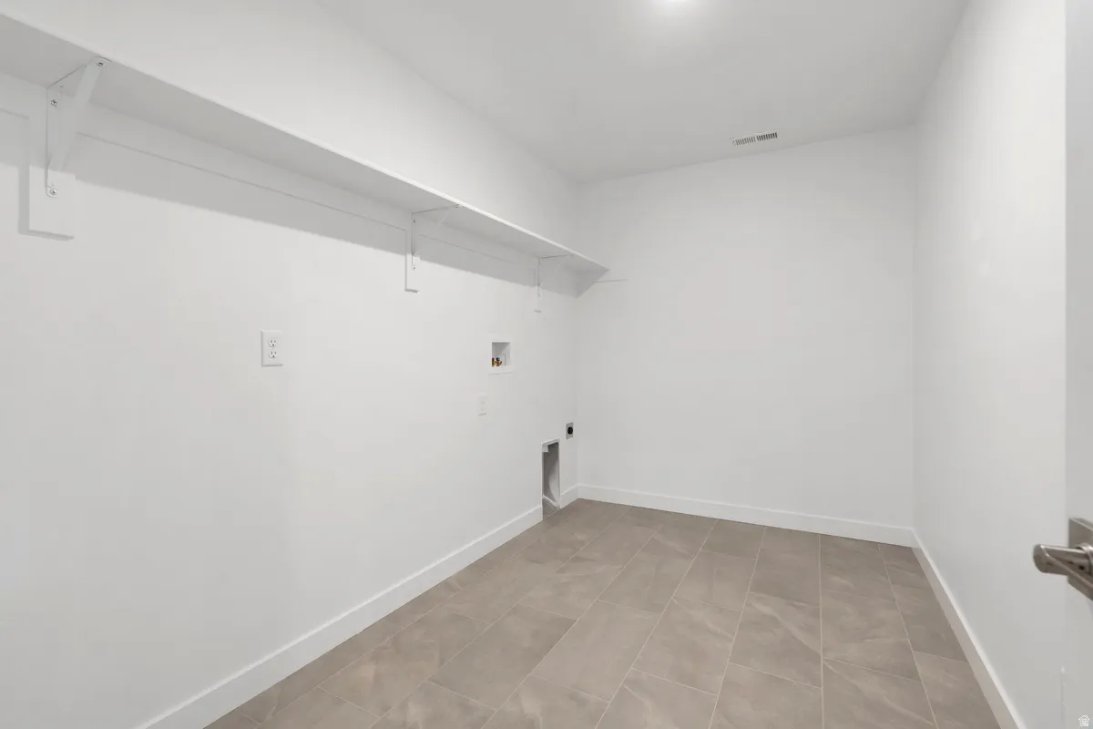 Laundry room with washer hookup and hookup for an electric dryer