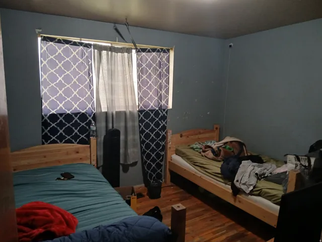 Bedroom with wood finished floors