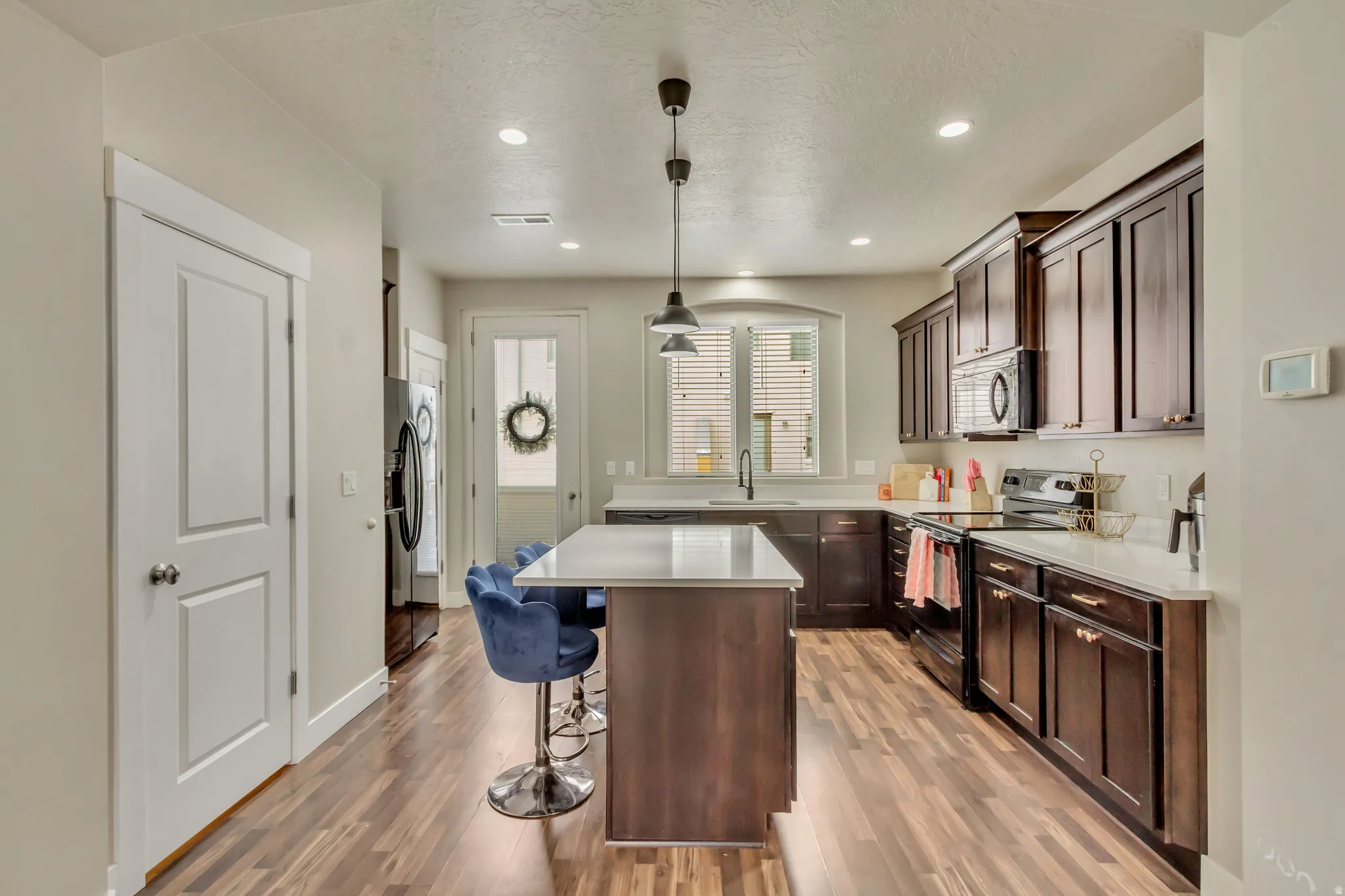 Kitchen with door to the back deck.
