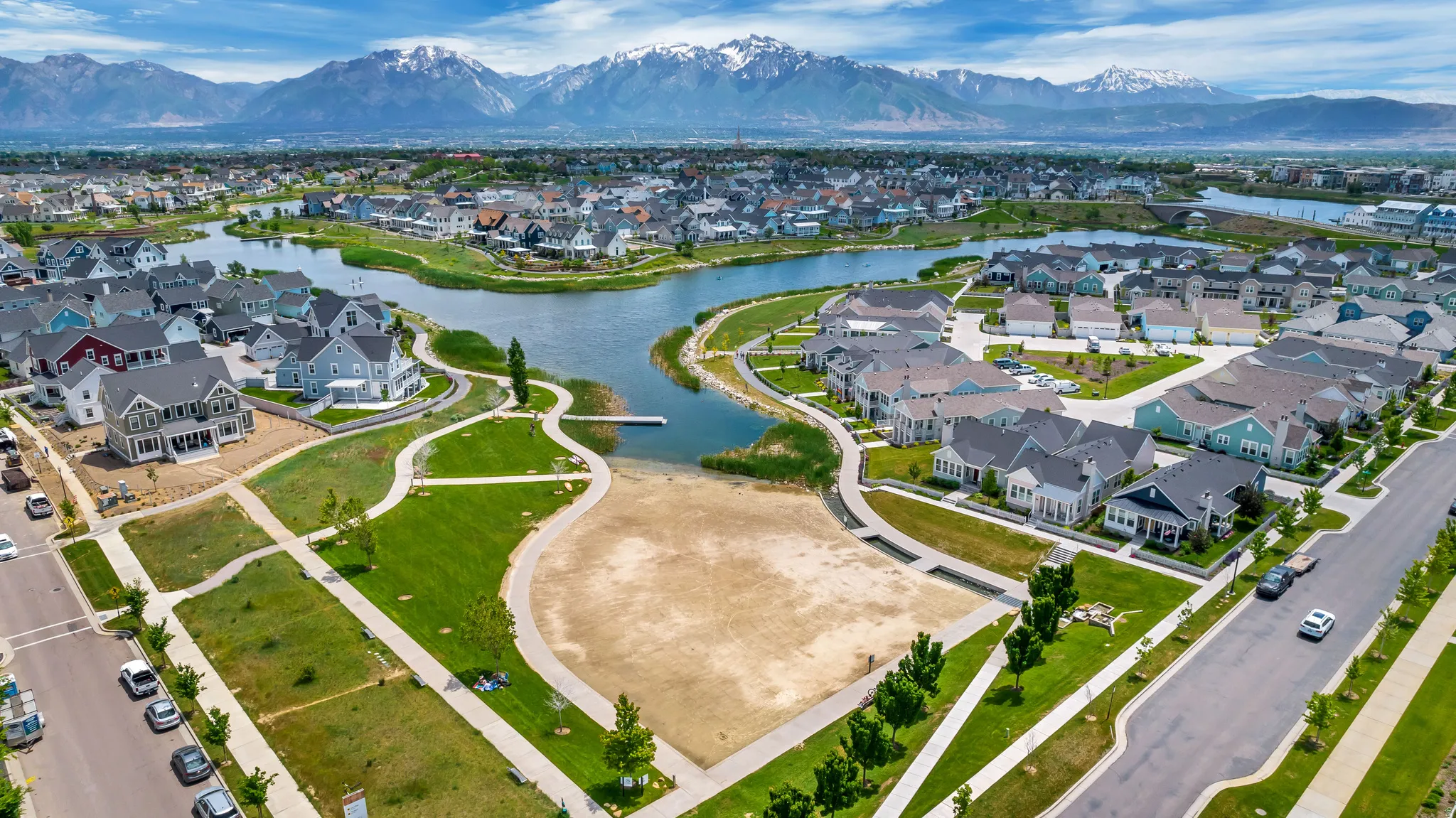 Aerial overview of property's location with nearby suburban area and a water and mountain view