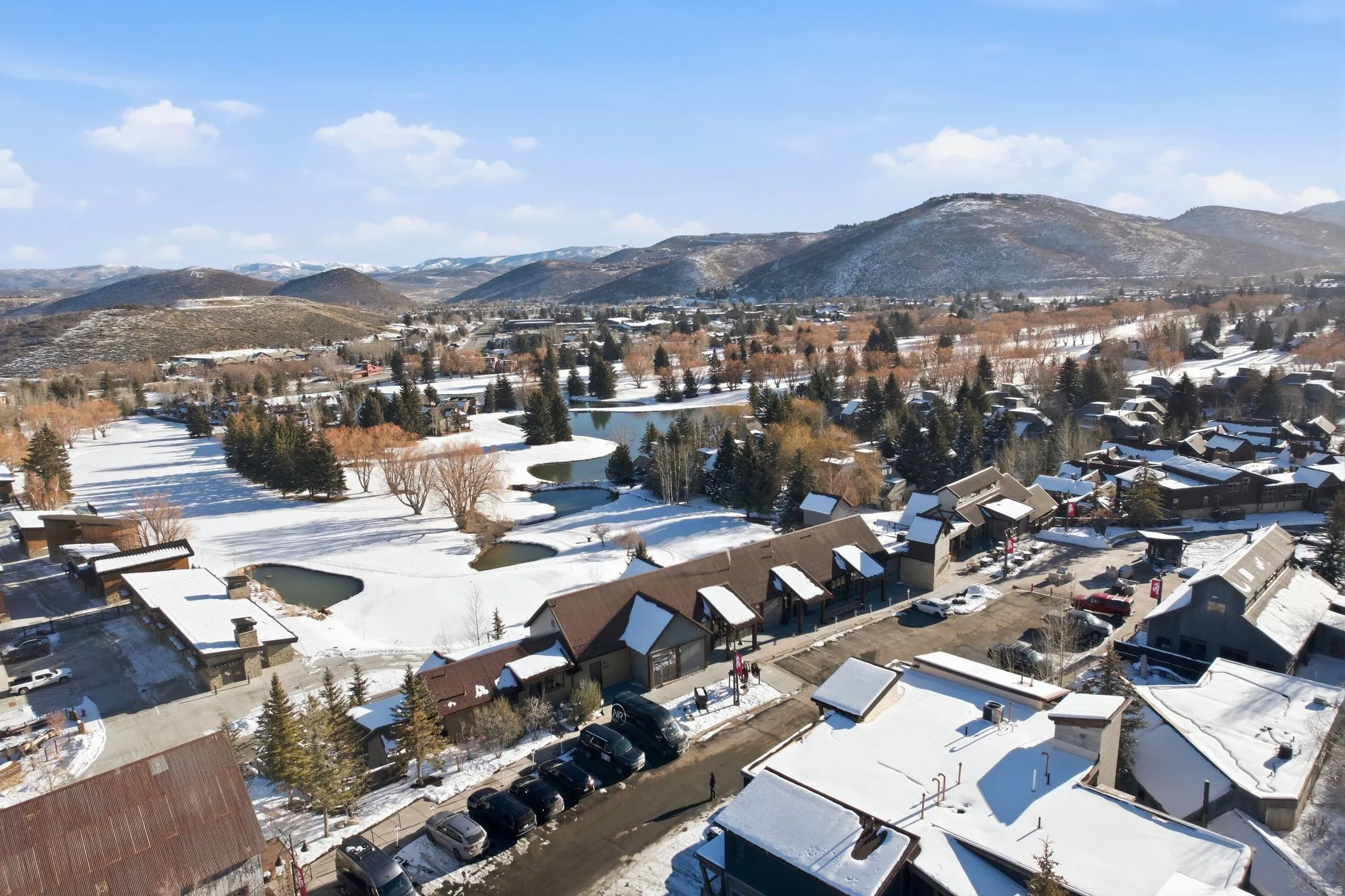 Snowy aerial view featuring a mountain view