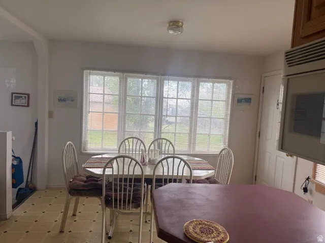 Dining space featuring healthy amount of natural light and light flooring
