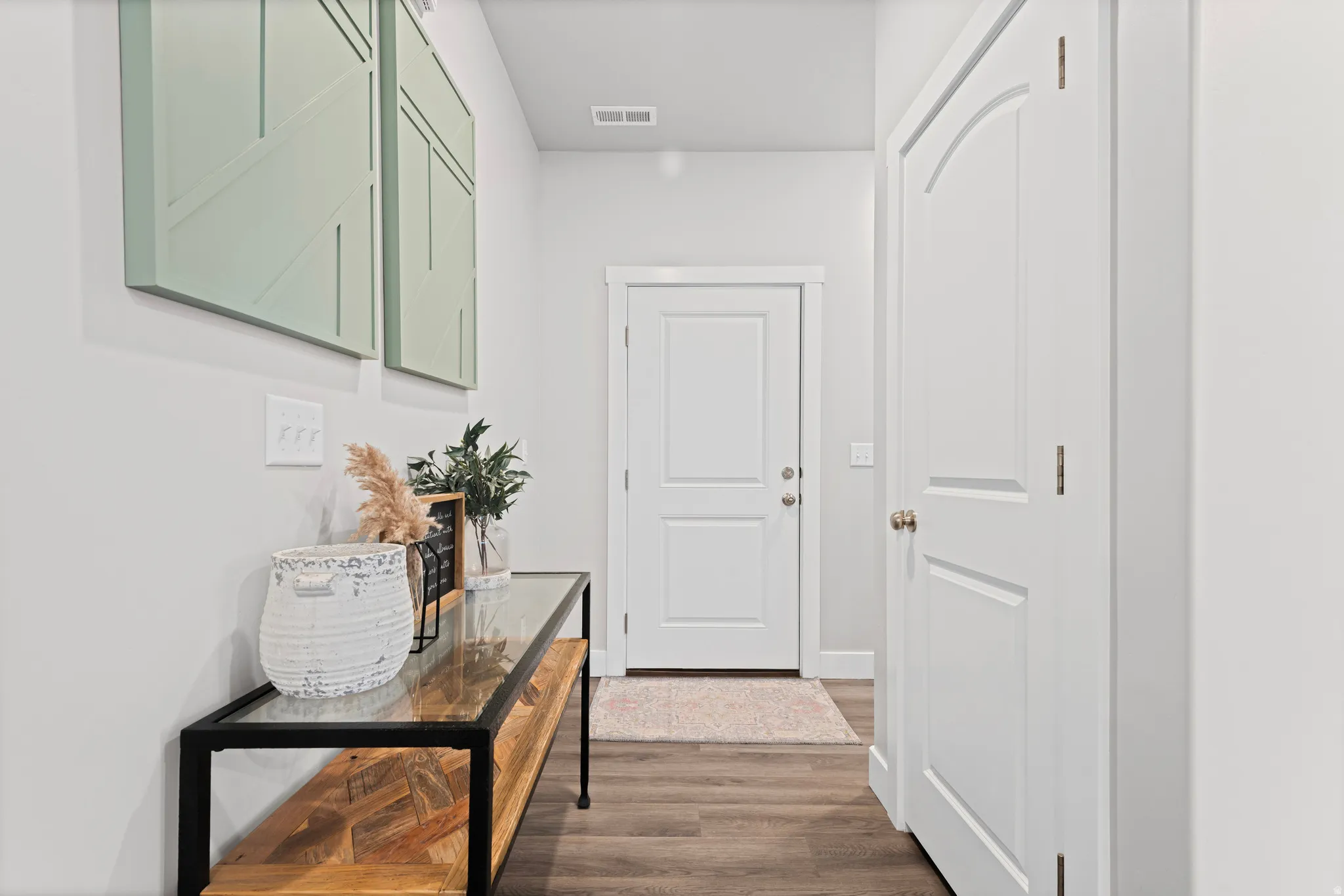 Hall with dark wood finished floors