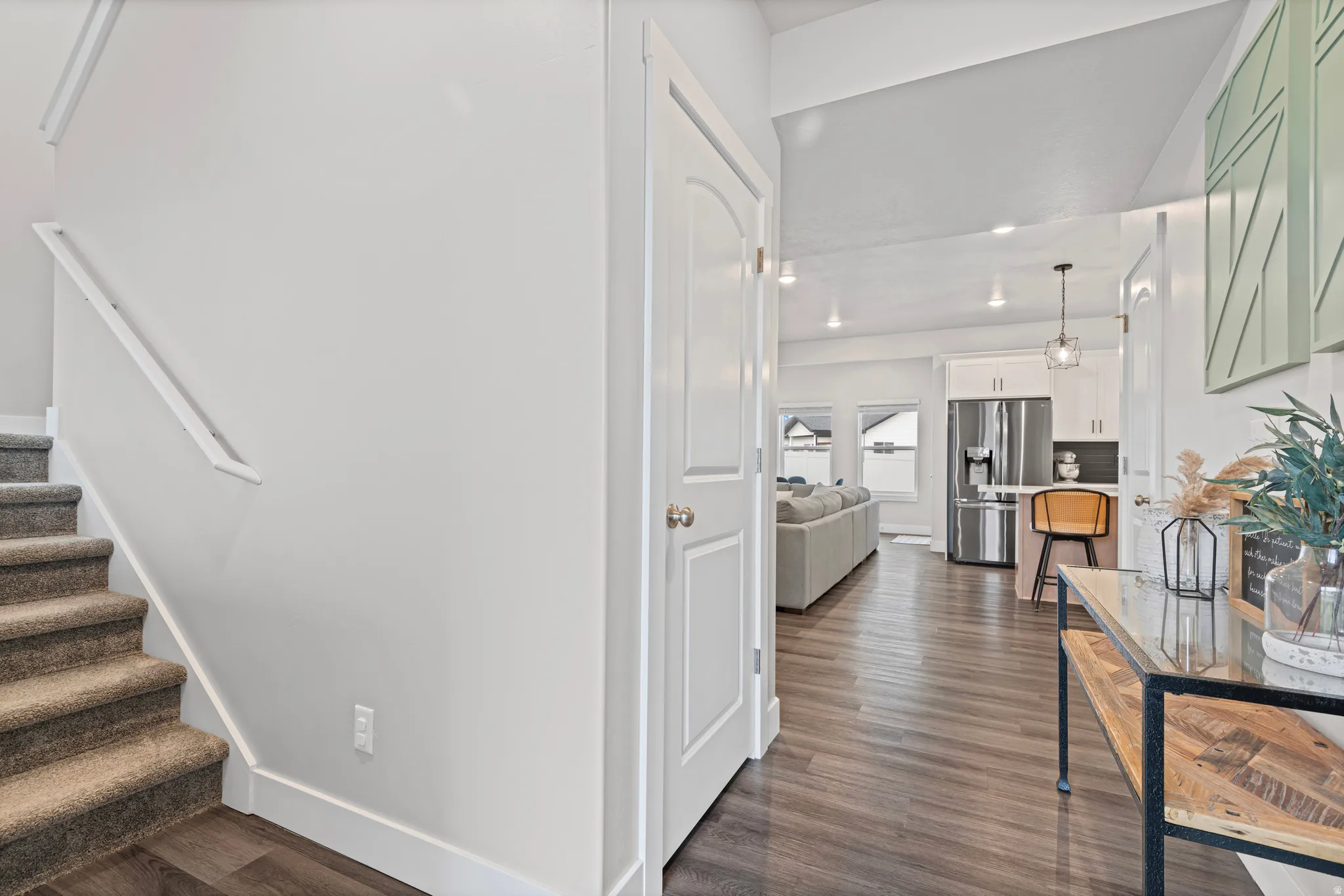 Stairs featuring wood finished floors and baseboards
