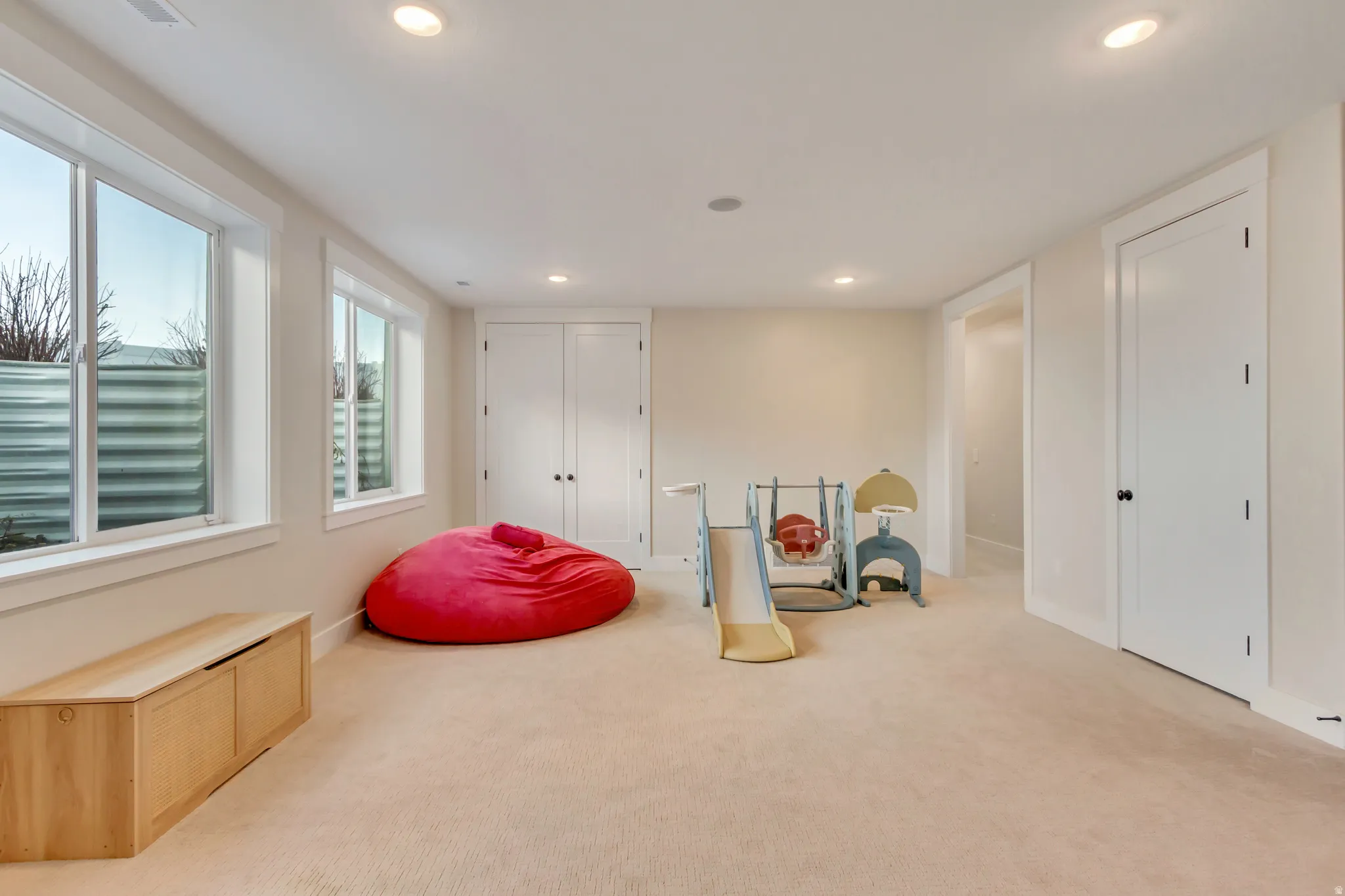 Recreation room featuring carpet floors and recessed lighting