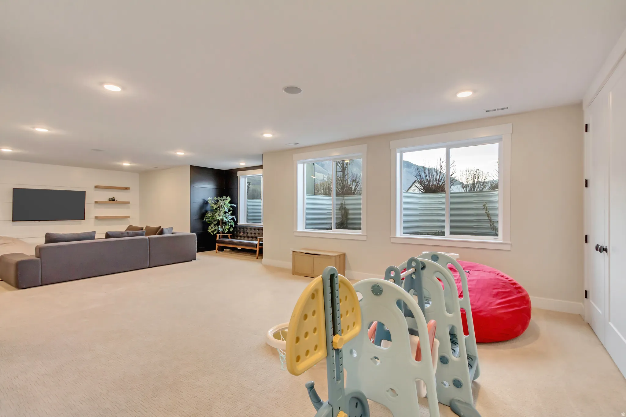 Playroom featuring light carpet and recessed lighting