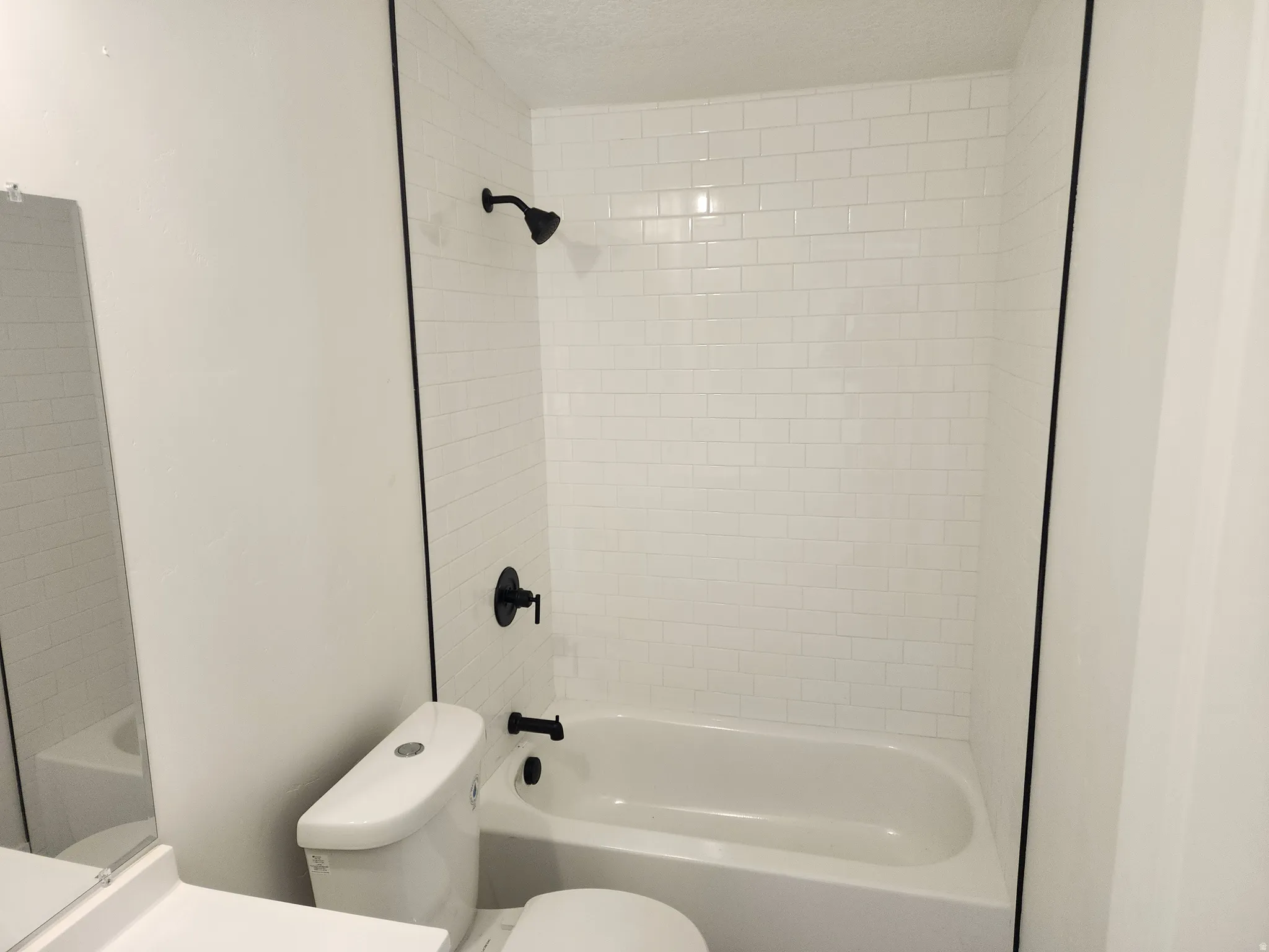 Full bathroom featuring vanity and shower / washtub combination