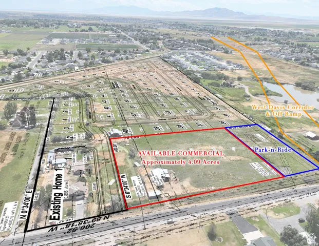 Aerial view of property and surrounding area featuring property boundaries highlighted and a mountain backdrop