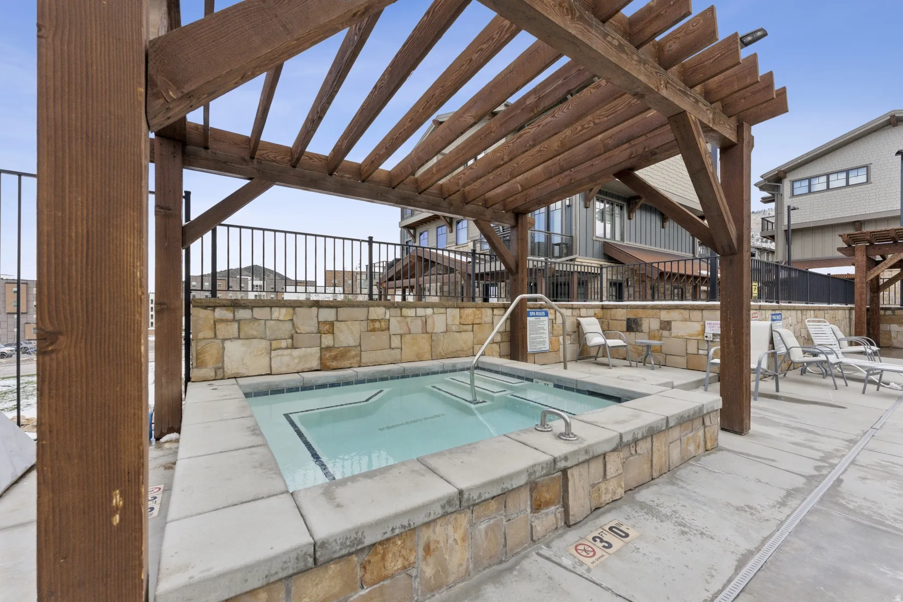 View of swimming pool featuring a pergola, a patio, and a hot tub